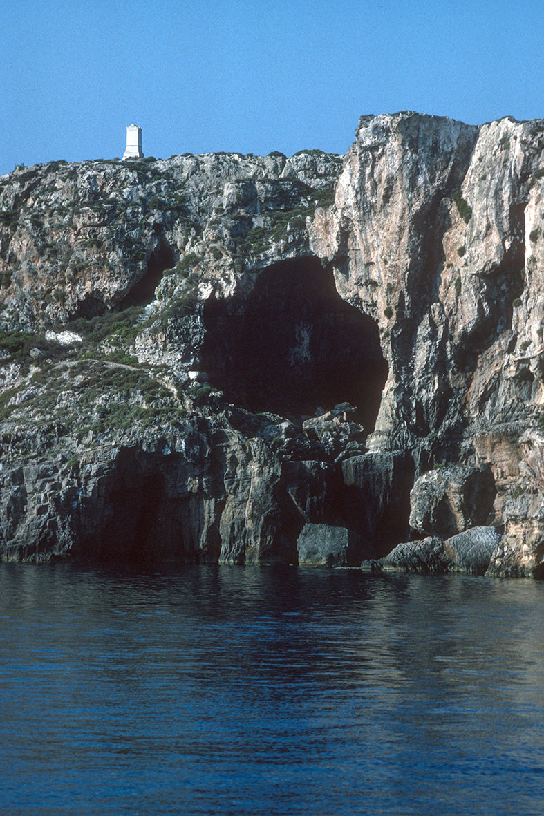 On top of the impressive rocks a monument in Sfaktiria