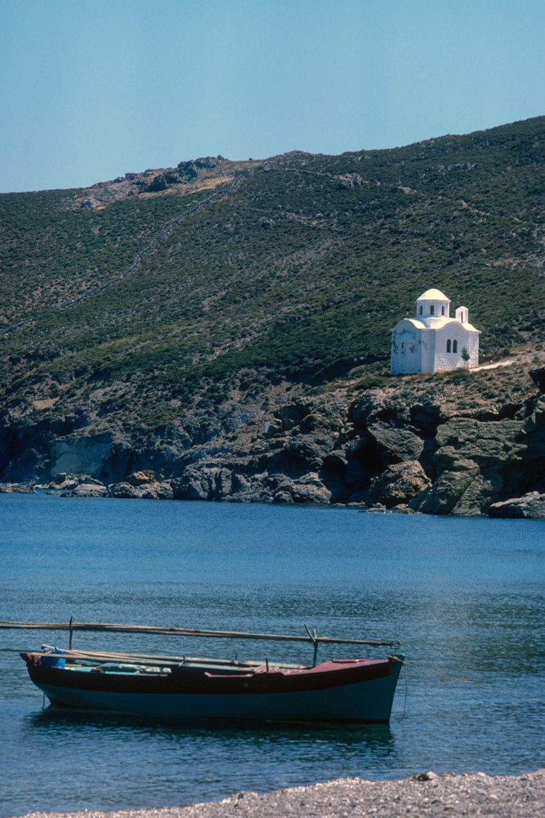 In Patmos a small boat and the view to the church