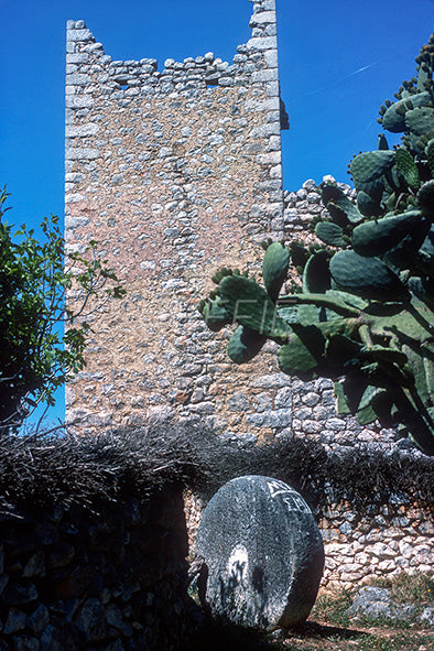 In Gardenitsa in Mani an old tower and the millstone