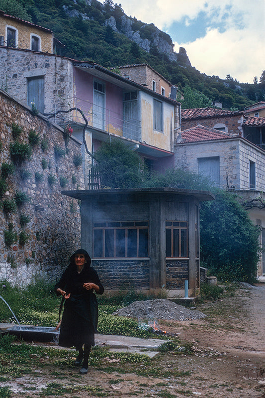 Laconia driving towards Tzitzina, the woman at the fountain