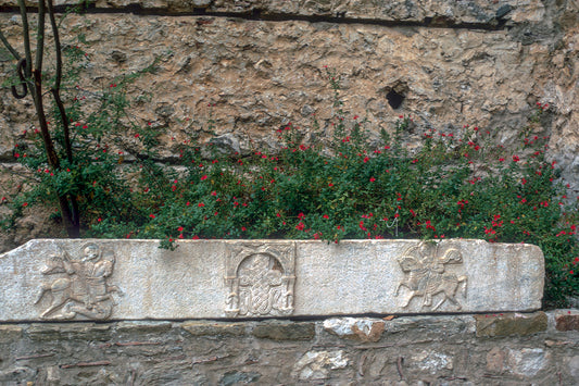 A relief marble among the flowers in Mystras