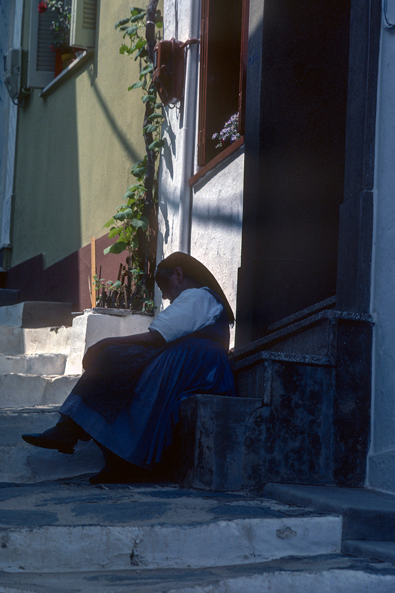 Skopelos the local lady in front of her house