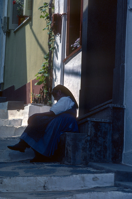 Skopelos the local lady in front of her house