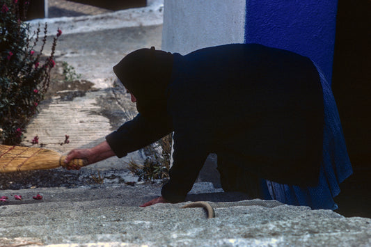 The old lady sweeping in Skopelos