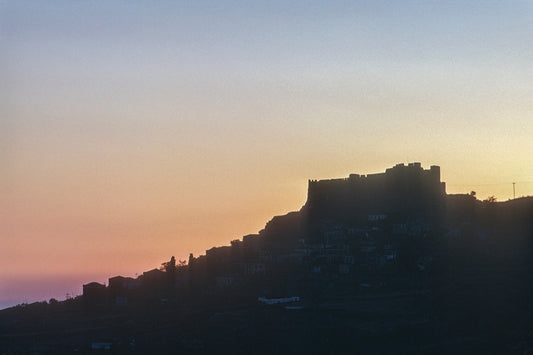 Mytilene, sunset in Molyvos with its impressive castle in the background