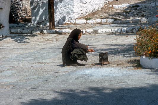 Samos, in Pythagorio an old lady preparing coffee