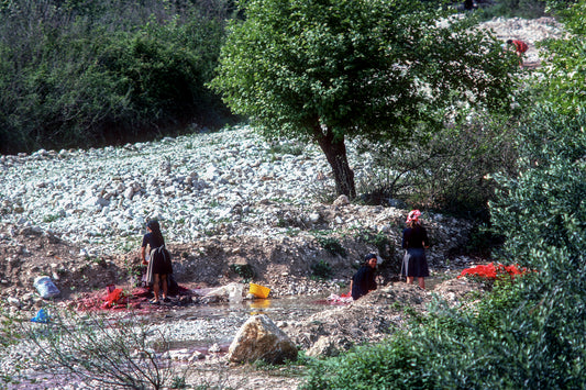 Epirus, towards Sagiada women are washing clothes in the river