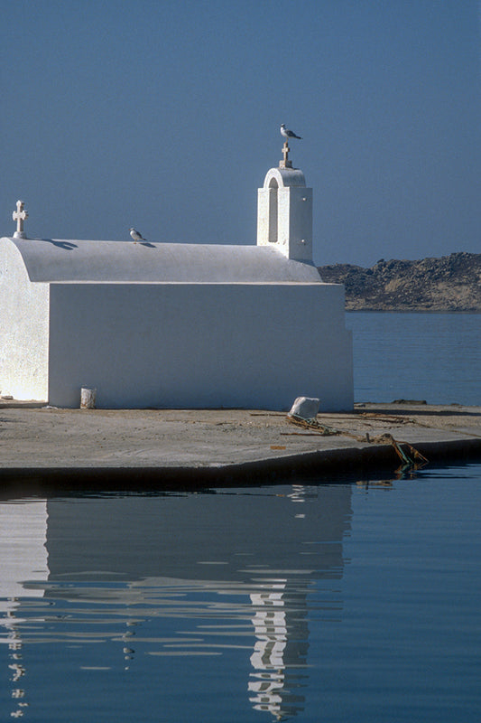 The small chapel, the seaguls in the port of Naxos island