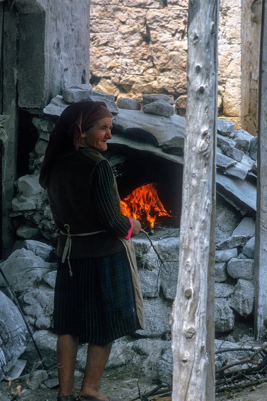 In Figalia, an old woman is baking