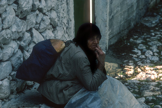 In Mani the old lady carrying the loaves