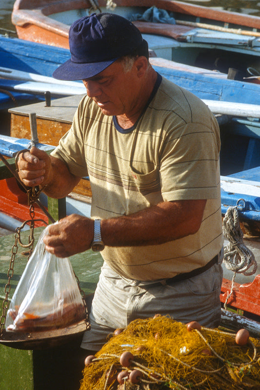 The fisherman in Sifnos weighing