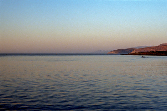 A small boat in the serenity of the Aegean Sea