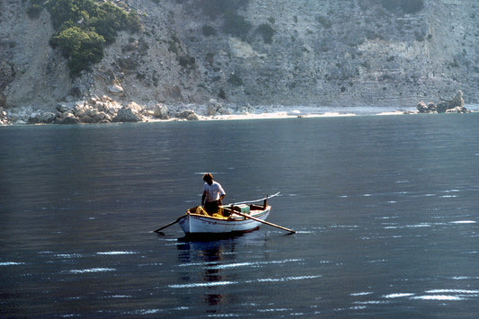 The fisherman with his small boat