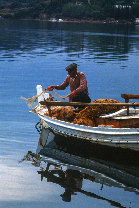 A fisherman in his old boat