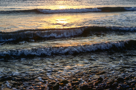 The sea shimmers at sunset