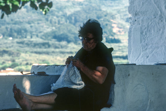 Knitting on her veranda