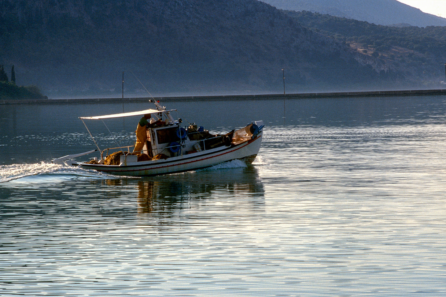 The fishing boat leaving Katapola